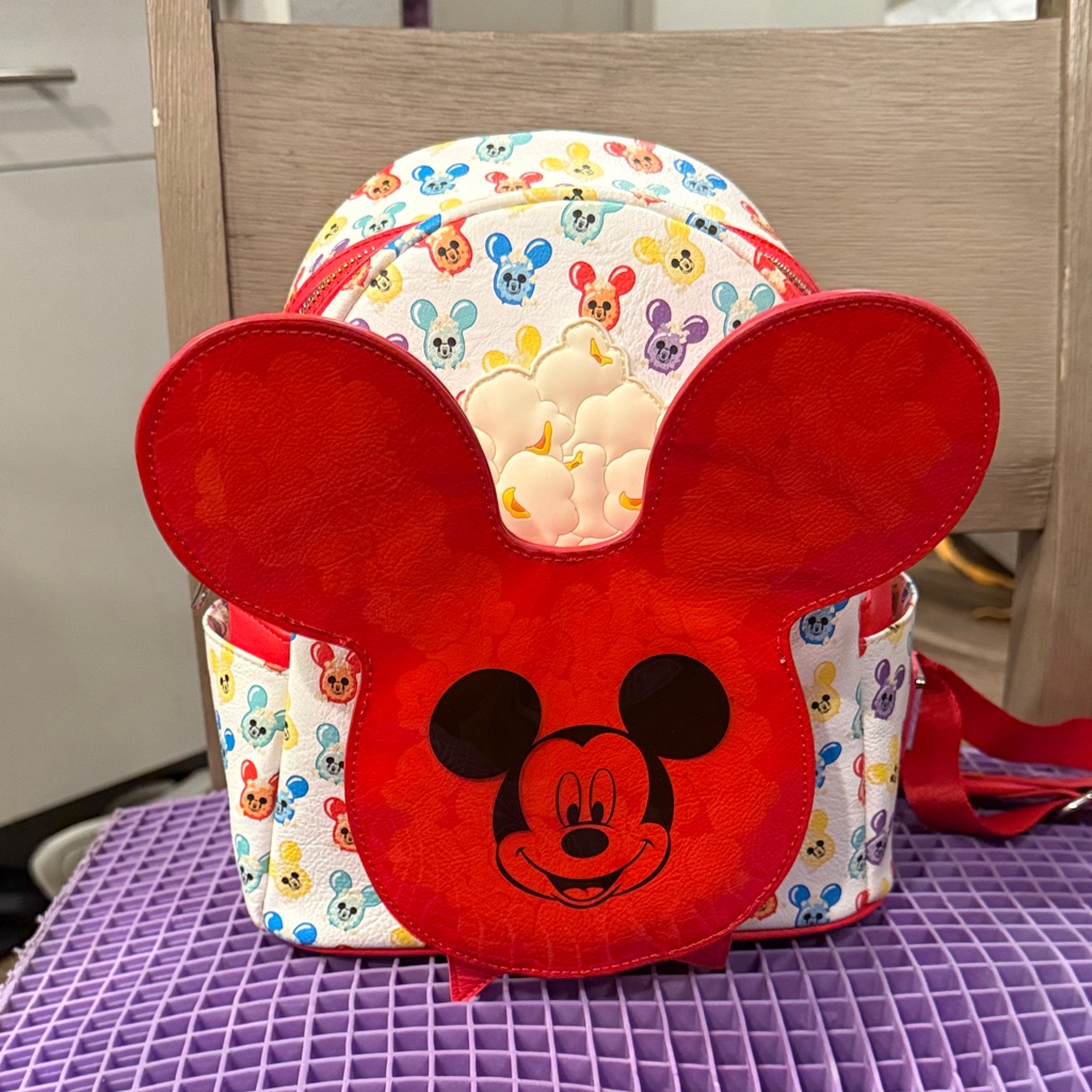Mickey-shaped popcorn bucket mini backpack with popcorn print, photographed for a marketplace listing